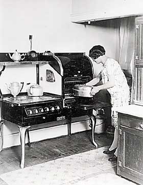Woman cooking with electricity
