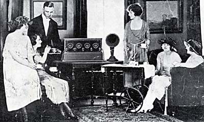 People gathered around a radio